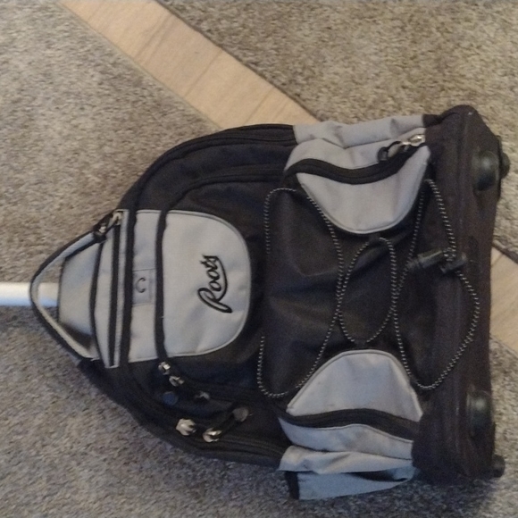 ROOTS WHEELED CARRY ON.  NUMEROUS COMPARTMENTS.  GENTLY USED. - Picture 2 of 9